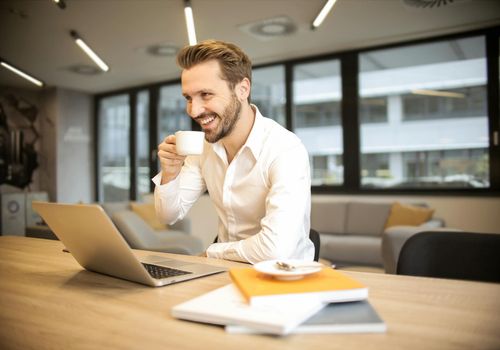 Professional man working at a desk looking relaxed