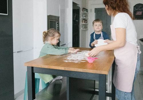 Young mother doing light movements at home